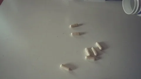 Capsules drop bottle Stock Footage 77695427