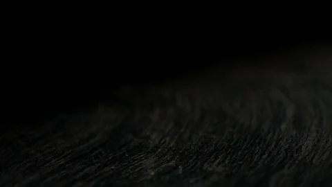 Capsules falling on the black surface in slow motion Stock Footage 81231243