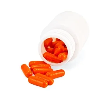 Capsules orange Stock Photos