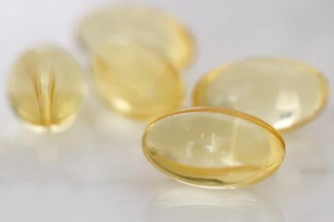 Capsules over  white background. Stock Photos