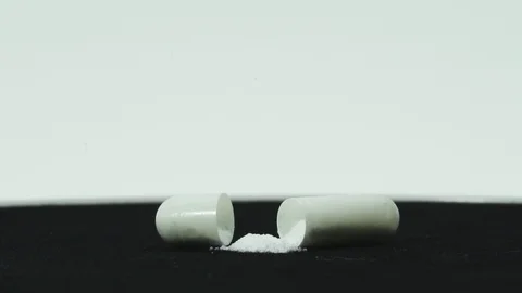 Capsules in the package rotate black background Vídeo Stock 107008742
