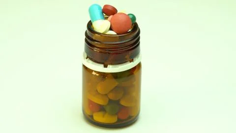 Capsules, pills, tablets on white table, top view. Stock Photos