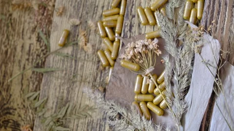 Capsules supplements of herbs and dried flowers,  Homeopathic Stock Footage 317000353