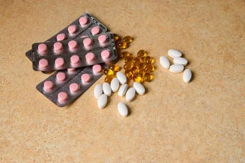 Capsules on a table with a pattern of sand Stock Photos