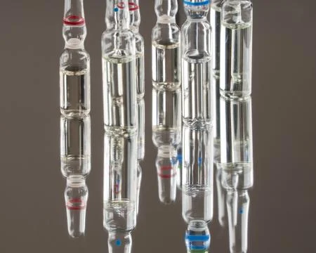 Capsules tablets on the mirror surface Stock Photos