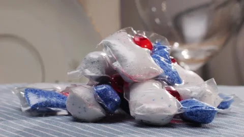 Capsules for washing dishes in the dishwashers close-up. Dishwasher is a machine Stock Footage 270010046