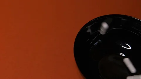 Capsules,white tablets fall black plate,Red table,background,medicine,virus Stock Footage 125351860