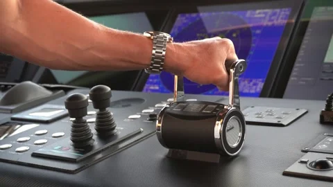Captain adjusts engine controls on modern yacht bridge. Stock Footage 332418102