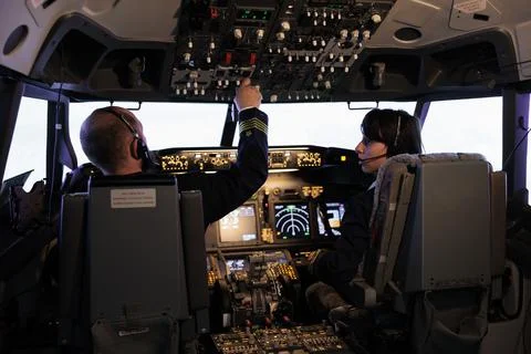 Captain and copilot using dashboard command to takeoff with plane Foto stock
