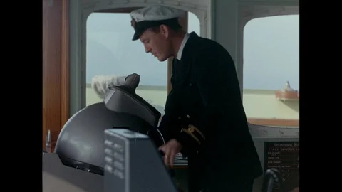 Captain and Steersman working in control cabin, United Kingdom, 1967 Stock Footage 139243442