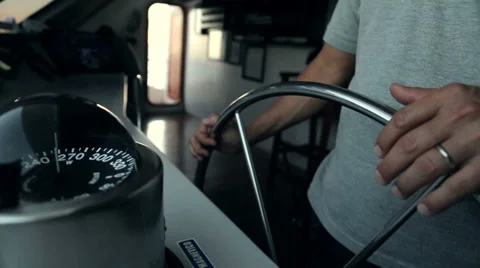 Captain on bridge holding the steering wheel Vidéo 28739904