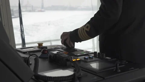 Captain on the bridge steers the ship. Hand turns azimuth controller. Stock Footage 148174906