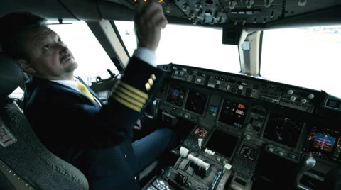 Captain in the cockpit of the plane prepares for takeoff Stock Footage 42016968