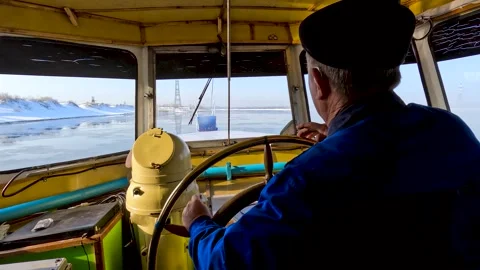Captain controls the movement of the ship on the winter river. Stock Footage 321612264
