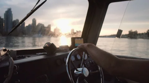 Captain cruising into the sunset with the skyline Stock Footage 122408932