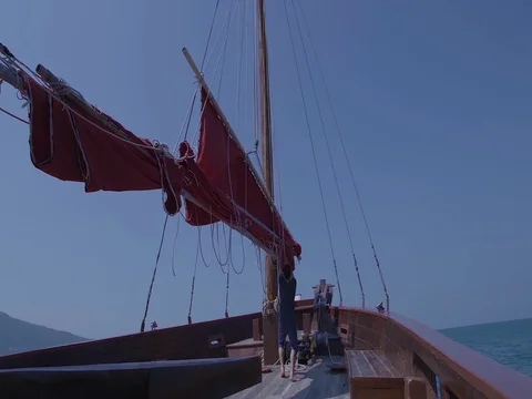 Captain on deck of large ship steering a wheel. Sailor at the helm of a sailboat Stock Footage 70154490
