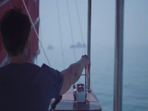 Captain on deck of large ship steering a wheel. Sailor at the helm of a sailboat 스톡 동영상 70171283