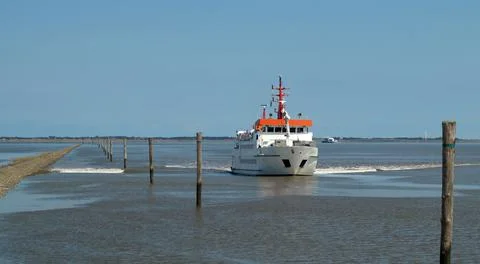 The captain of this ferry has to know the deep passages exactly on this sea Stock Photos