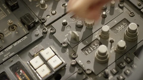 Captain hand operates cockpit buttons of airplane Stock Footage 99984921
