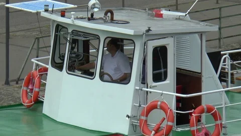 Captain inside Cabin of a Passenger Boat Stock Footage 82957046