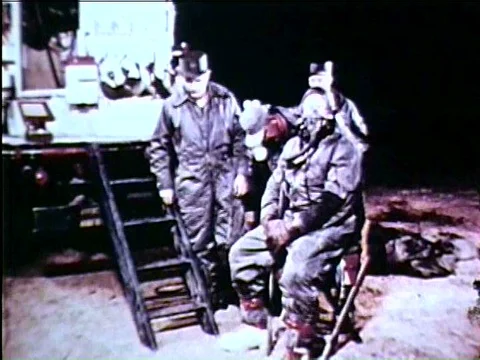 Captain Joseph Kittinger is fitted with a backpack and other equipment in Stock Footage 75283333