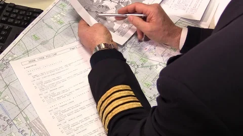 Captain pilot and crew are studying flight plan before the departure Stock Footage 90087271