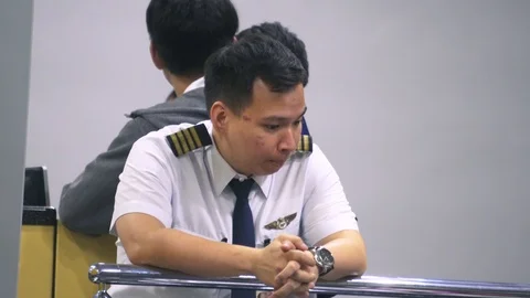  captain pilot with face reaction worry at Airport Stock Footage 114256774