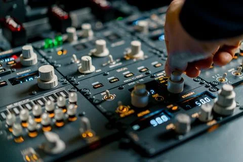 The captain presses the buttons on the control panel to start the engine of the Stock Photos