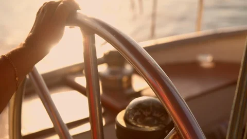Captain rides vessel on the sunset Stock Footage 92044620