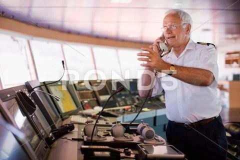 Captain Of A Ship Having A Phone Call