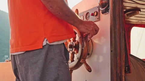 The captain of the ship is at the helm and controls the direction of the fishing Stock Footage 219722764