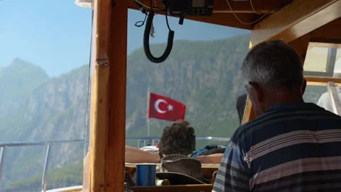 Captain of the ship at the helm of the boat, sailing on the sea Vidéo 236084740