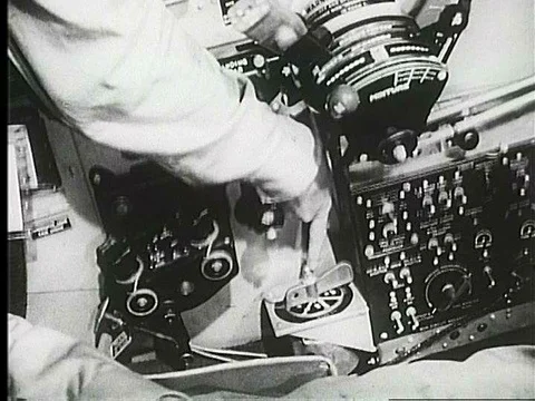 A captain shows a lieutenant the controls in the cockpit of a United States Vídeos de archivo 75292257