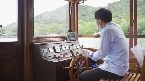 The captain steered the ship Stock Footage 162648923