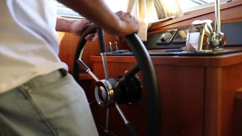 Captain steering a boat, close up of hands Stock Footage 181571955