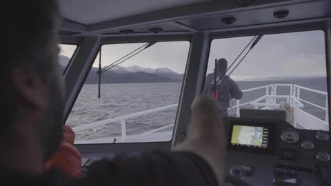 Captain steering ship through channel in Argentina Patagonia Stock Footage 104187817