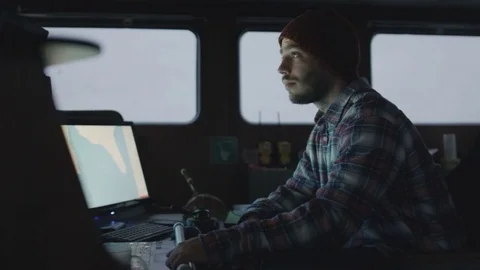 Captain Surrounded by Monitors and Screens with Sea Maps. Stock Footage