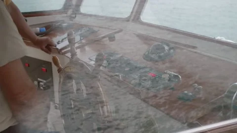 The captain turns the helm Video stock 169659870