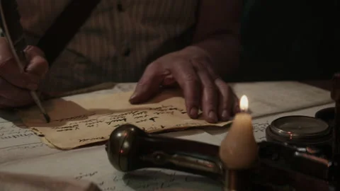 A captain writing something in an old ship cabin Stock-Footage 259697484