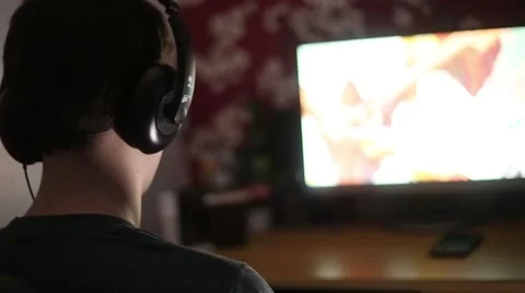 Captivated Gamer Plays Online Video stock 45842698