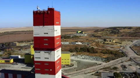 Captivating Aerial View of a Red and White Industrial Tower from Above and Stock Footage 284861563