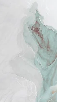 Captivating alcohol ink abstract with soft teal and white swirls on textured Foto stock