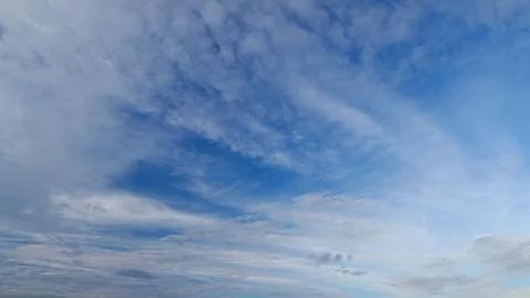 Captivating and Beautiful Clouds Over a Clear Blue Sky on a Peaceful Day of Dayl Stockfoto's