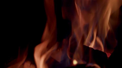 Captivating and Beautiful Flames Are Dancing Gracefully in the Darkness of the N Stock Footage 310572148