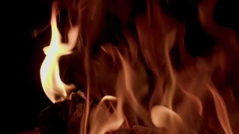 Captivating and Enigmatic Flames Dancing Gracefully in the Embrace of the Dark N Stock Photos