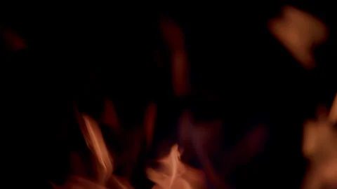 The captivating and mesmerizing flames are dancing gracefully in the surrounding Stock Footage 310572102