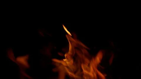 Captivating and mesmerizing Flames dance vibrantly against a Dark Background, cr Stock Photos