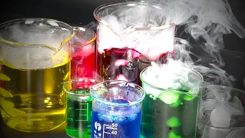 A captivating array of colorful chemical reactions in beakers creating mesm.. Stock Footage 332763014