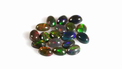 Captivating Array of Colorful Opal Stones Displayed on a Clean Background Stock Footage 292406507