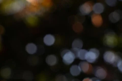 Captivating bokeh effect with shimmering spots and abstract shapes, ideal f.. Stock Photos